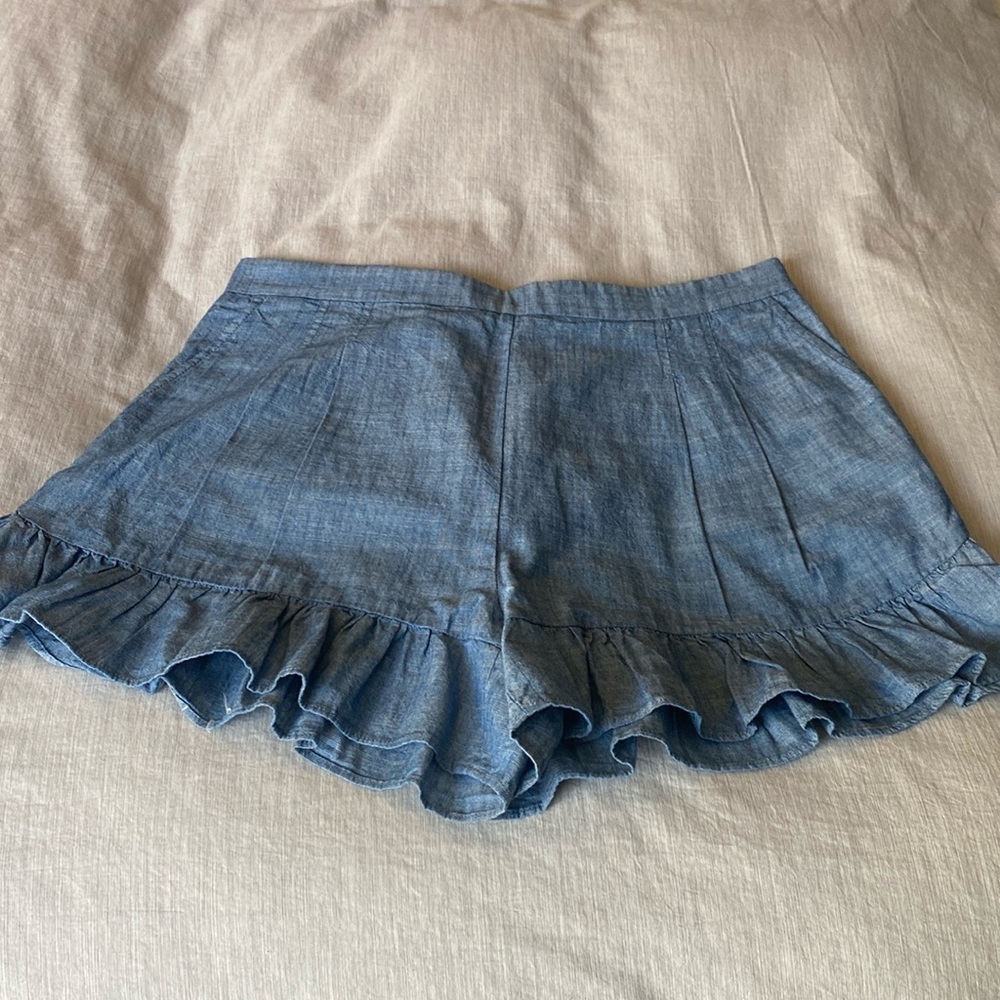 The cutest J Crew ruffled chambray shorts . Never worn. Size 10. Hidden zipper